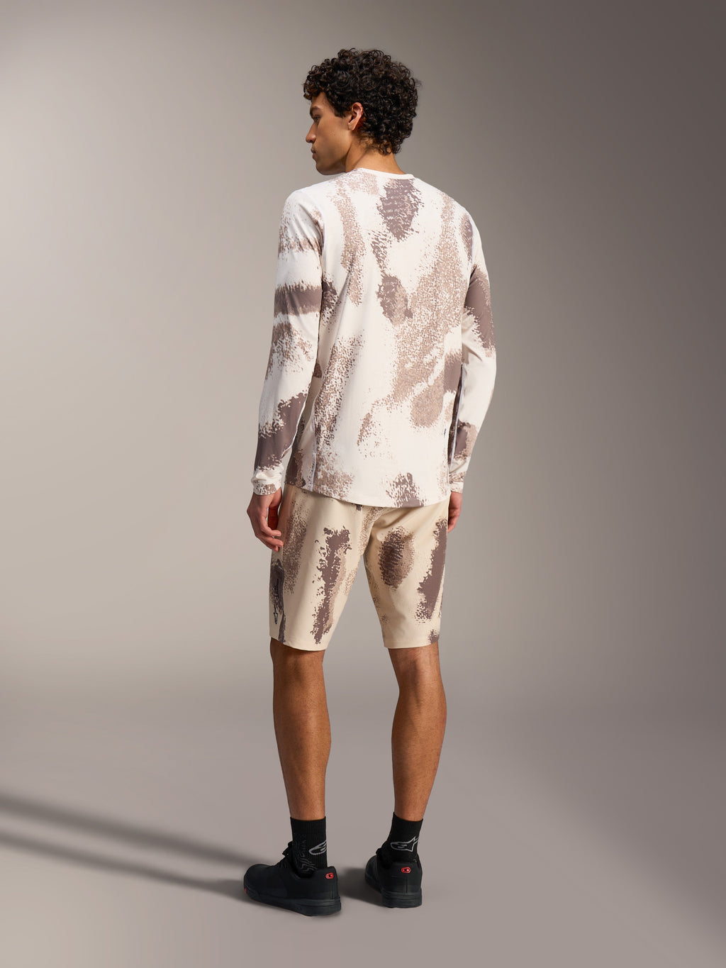 A-Dura Ride LS Jersey and matching Shorts in Sand Camo, technical mountain bike gear with a textured camouflage pattern.