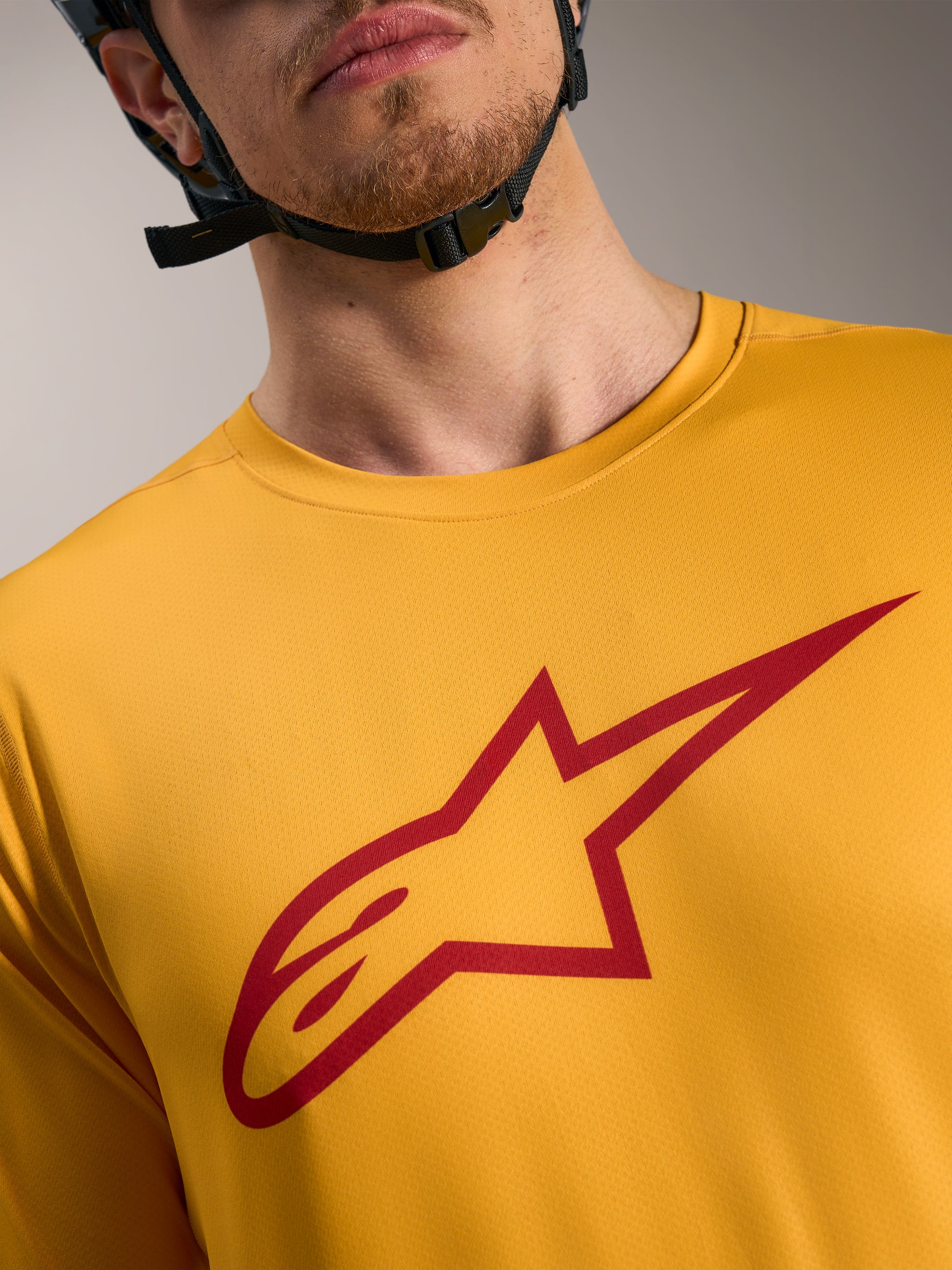 Orange A-Dura Ride Short Sleeve Jersey with a red Astars logo on the chest, lightweight MTB performance apparel.