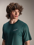 Alpinestars A-Dura Rise Jersey - Short Sleeve, Silver Pine green, worn by a model, small white Astars logo on chest, jacquard performance fabric, casual mountain bike apparel