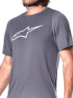 Alpinestars A-Dura Dri Astar Jersey, Short Sleeve Cycling Jersey, Dark Gray, featuring a large white Astar logo on the chest, mesh ventilation panels on the sleeves, technical mountain bike apparel for performance riding
