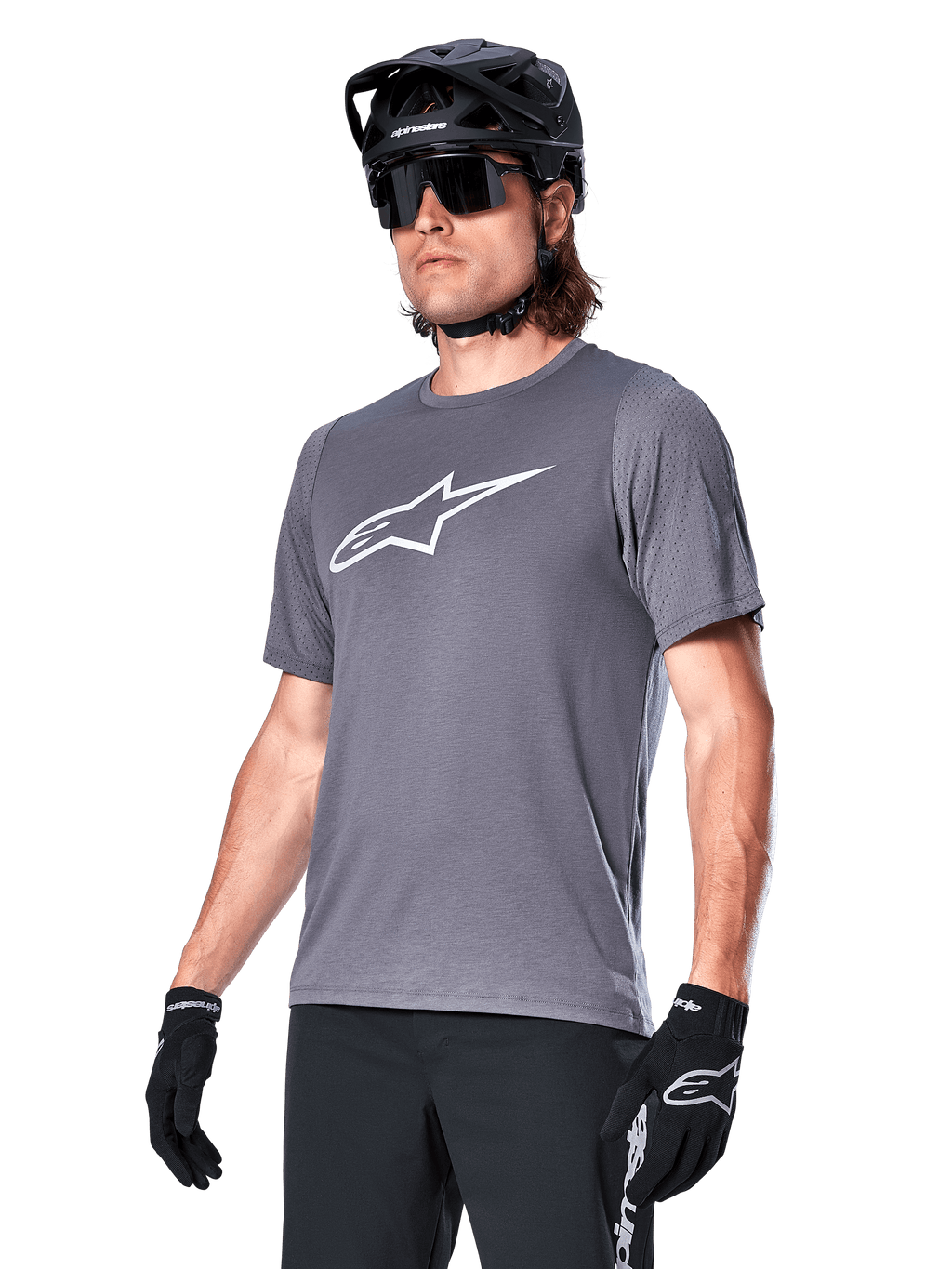 Alpinestars A-Dura Dri Astar Short Sleeve Jersey, Dark Gray, white chest logo and mesh sleeve panels, worn with black MTB helmet, sunglasses, and gloves, performance mountain biking apparel