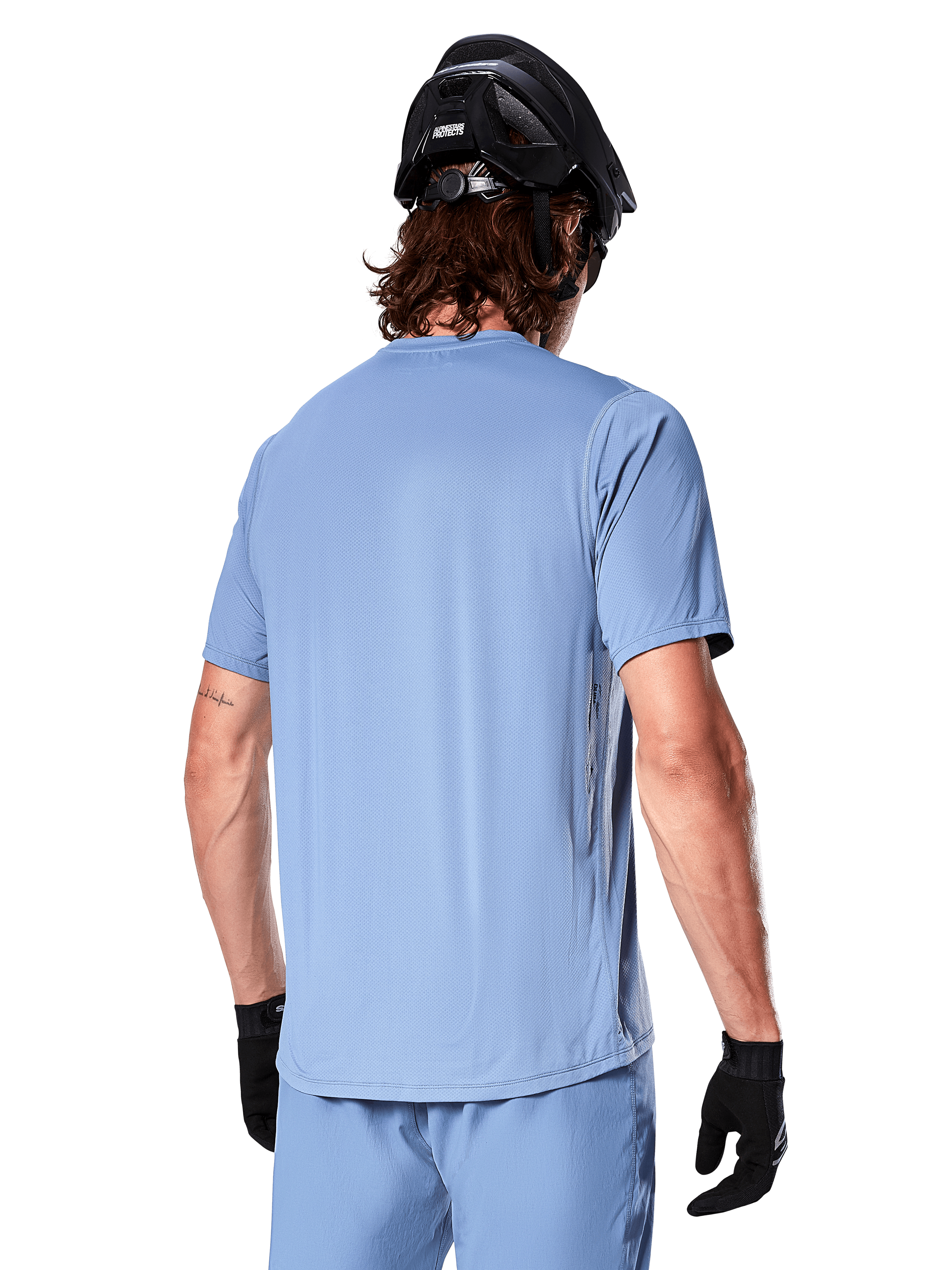 Alpinestars A-Dura Astar Short Sleeve Men's MTB Jersey in Infinity Blue, rear view on a rider for off-road trail riding.