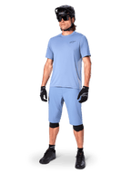 Alpinestars A-Dura Astar Jersey, Men's Infinity Blue MTB shirt, with matching shorts and black protective gear.