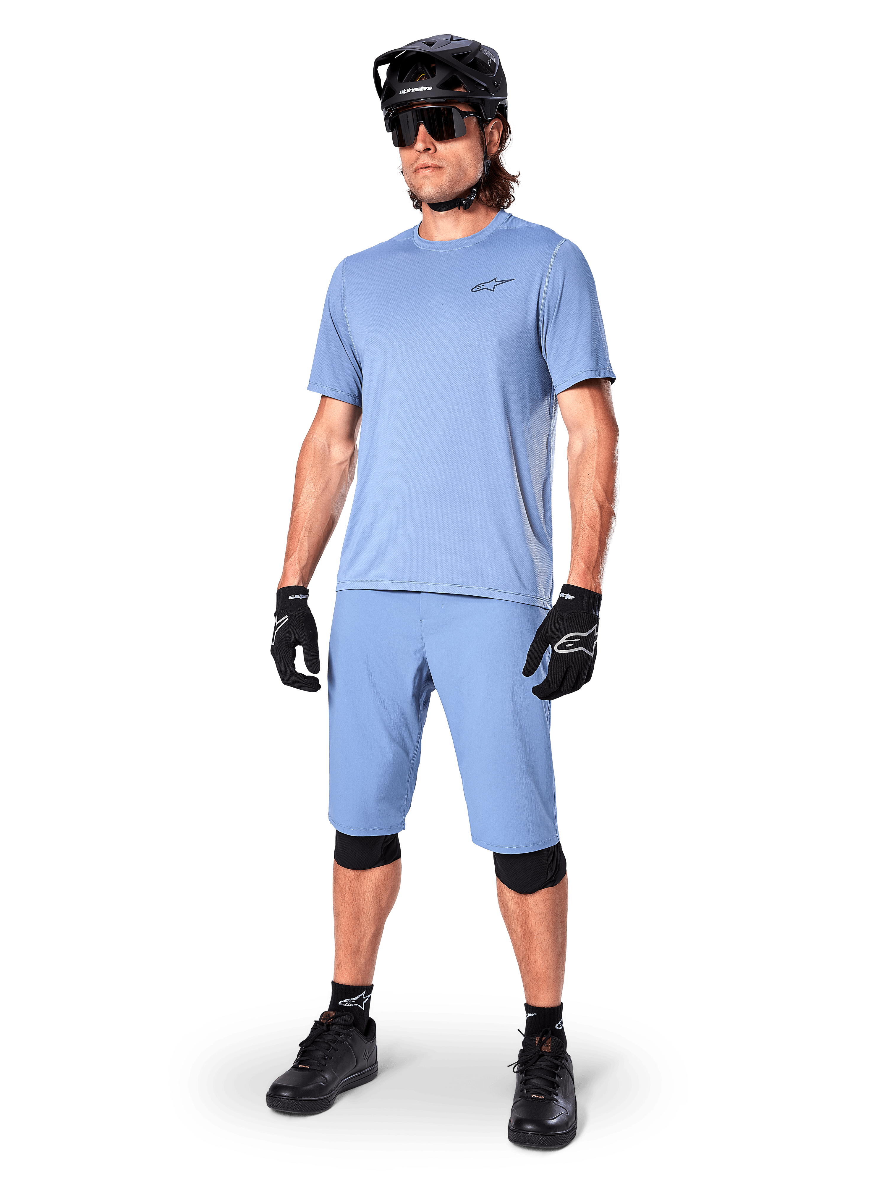 Alpinestars A-Dura Astar Jersey, Men's Infinity Blue MTB shirt, with matching shorts and black protective gear.