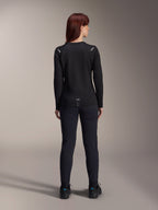 Alpinestars Woman Stella A-Dura Thermal Jersey, Back View, Black, Long-sleeve cycling jersey with insulated fleece, worn with matching black pants and shoes, featuring small A-Dura branding on the lower back and reflective shoulder accents, tailored for women's MTB riding.