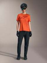 Orange Stella A-Dura Ride Short Sleeve Jersey with a maroon logo, worn with black MTB gear, helmet, and gloves.