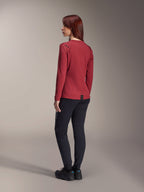 Alpinestars Stella A-Dura Thermal Jersey, Women's long-sleeve mountain bike jersey, Burgundy, back view highlighting the extended drop tail and thermal fabric texture, worn with black MTB pants and black footwear
