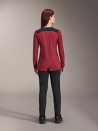 Alpinestars Women Stella A-Dura Dri Astar Long Sleeve Jersey, Burgundy Red with black mesh shoulder panels, technical MTB apparel shown from the back with black pants, drop tail design for cycling coverage
