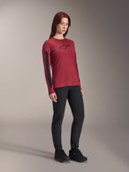 Alpinestars Women Stella A-Dura Dri Astar Long Sleeve Jersey, Burgundy red with black chest logo and black mesh panels on the sleeves, worn with black technical pants and black riding shoes, high-performance mountain bike apparel for women