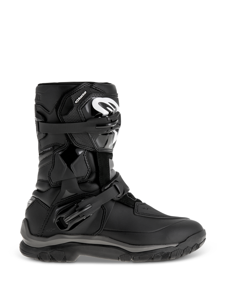 Alpinestars Belize Drystar Boots, Black Adventure Touring Boots, featuring a mid-height design with dual adjustable buckles, rugged textured outsole for grip, reinforced protection panels, white logo on the shin, waterproof motorcycle footwear