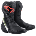 Alpinestars Supertech R Boots, performance motorcycle racing boots, black with red Alpinestars logo on the shin, white and fluorescent yellow accents, featuring technical microfiber construction and protective TPU shin plates.