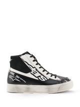 Alpinestars Stella Stated Flair Shoes, Women's High-Top Riding Shoes, Black and White, featuring perforated leather panels, bold logo branding, and a distressed worn-look sole, motorsport-inspired urban streetwear.
