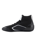 Alpinestars Supertech Shoes, Auto Racing Shoes, Black, side profile view featuring a knitted upper, carbon fiber heel cup, and white geometric accents, professional motorsport footwear