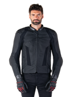 Alpinestars Missile V3 Leather Jacket, Black Motorcycle Racing Jacket, worn by model with matching black gloves and pants, featuring perforated leather for ventilation, external shoulder sliders, and sleek sport riding design