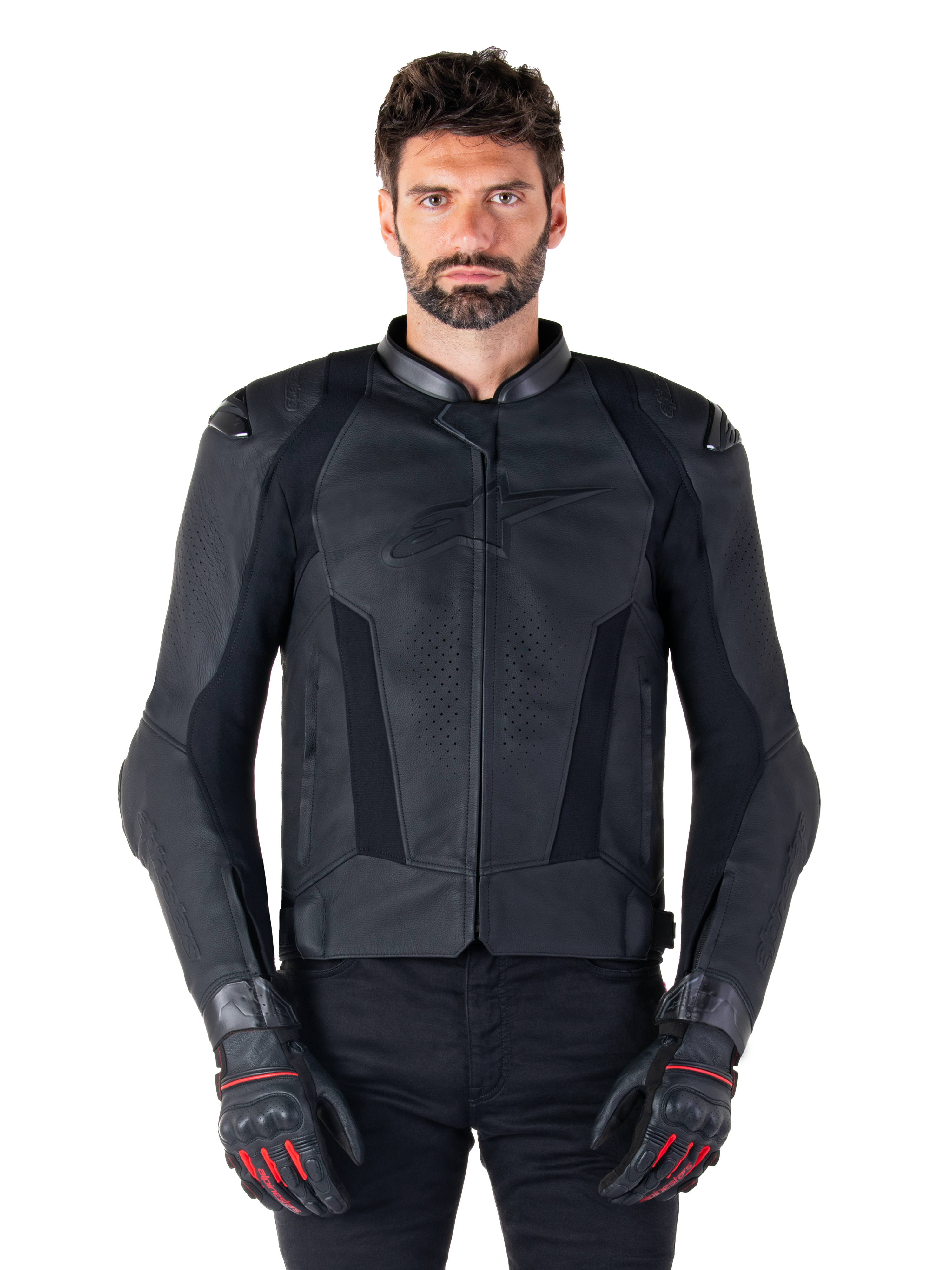 Alpinestars Missile V3 Leather Jacket, Black Motorcycle Racing Jacket, worn by model with matching black gloves and pants, featuring perforated leather for ventilation, external shoulder sliders, and sleek sport riding design