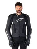 Alpinestars Missile V3 Leather Jacket, Black with White Logos, worn by a model with black riding gloves, premium leather motorcycle racing jacket with perforated ventilation panels and performance riding features