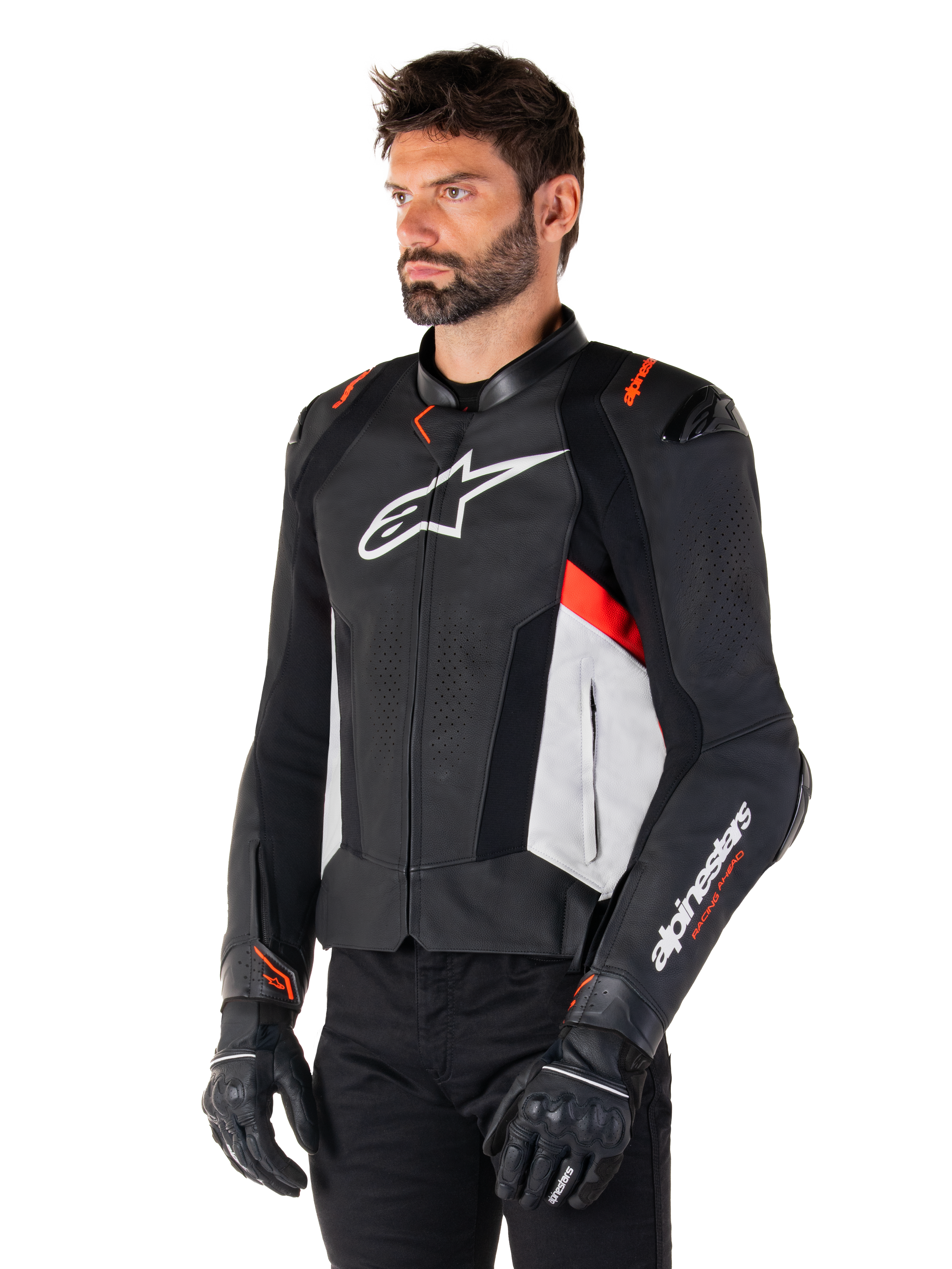 Alpinestars Missile V3 Leather Jacket, Black White and Red Fluo, racing sport motorcycle jacket worn by a model with black gloves and pants, featuring perforated leather panels and bold Alpinestars branding