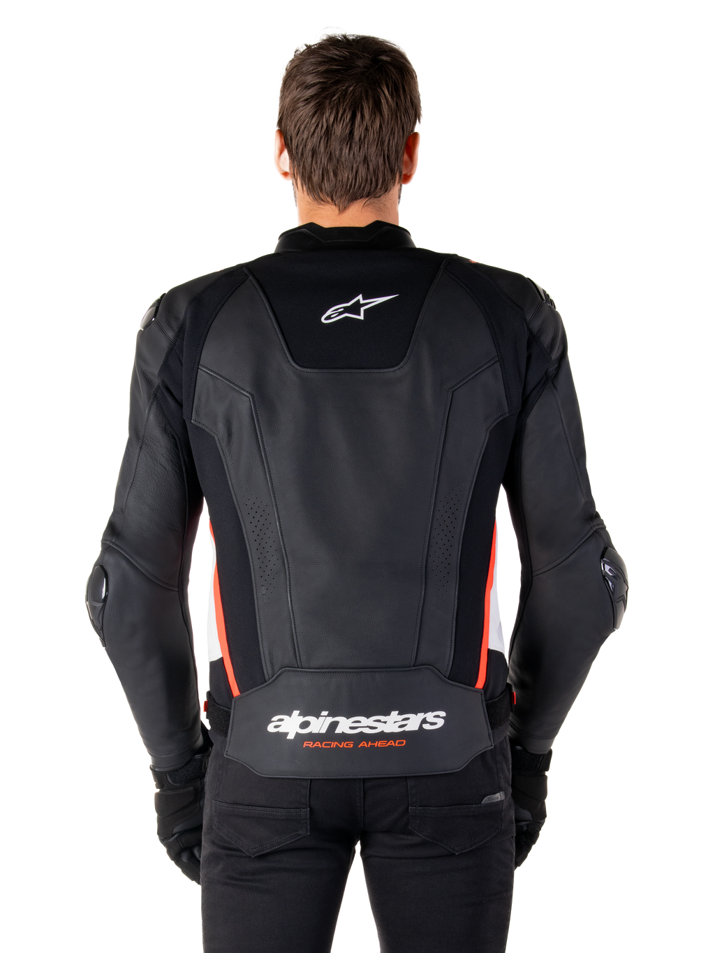 Alpinestars Missile V3 Leather Jacket, back view, premium black leather with red fluo and white accents, featuring a white star logo on the upper back and Alpinestars branding on the lower back, worn with black pants and gloves.