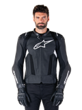 Alpinestars Missile V3 Airflow Leather Jacket, Black and White, motorcycle racing jacket with perforated leather ventilation panels, large white star logo on chest, worn with matching gloves, sporty protective design