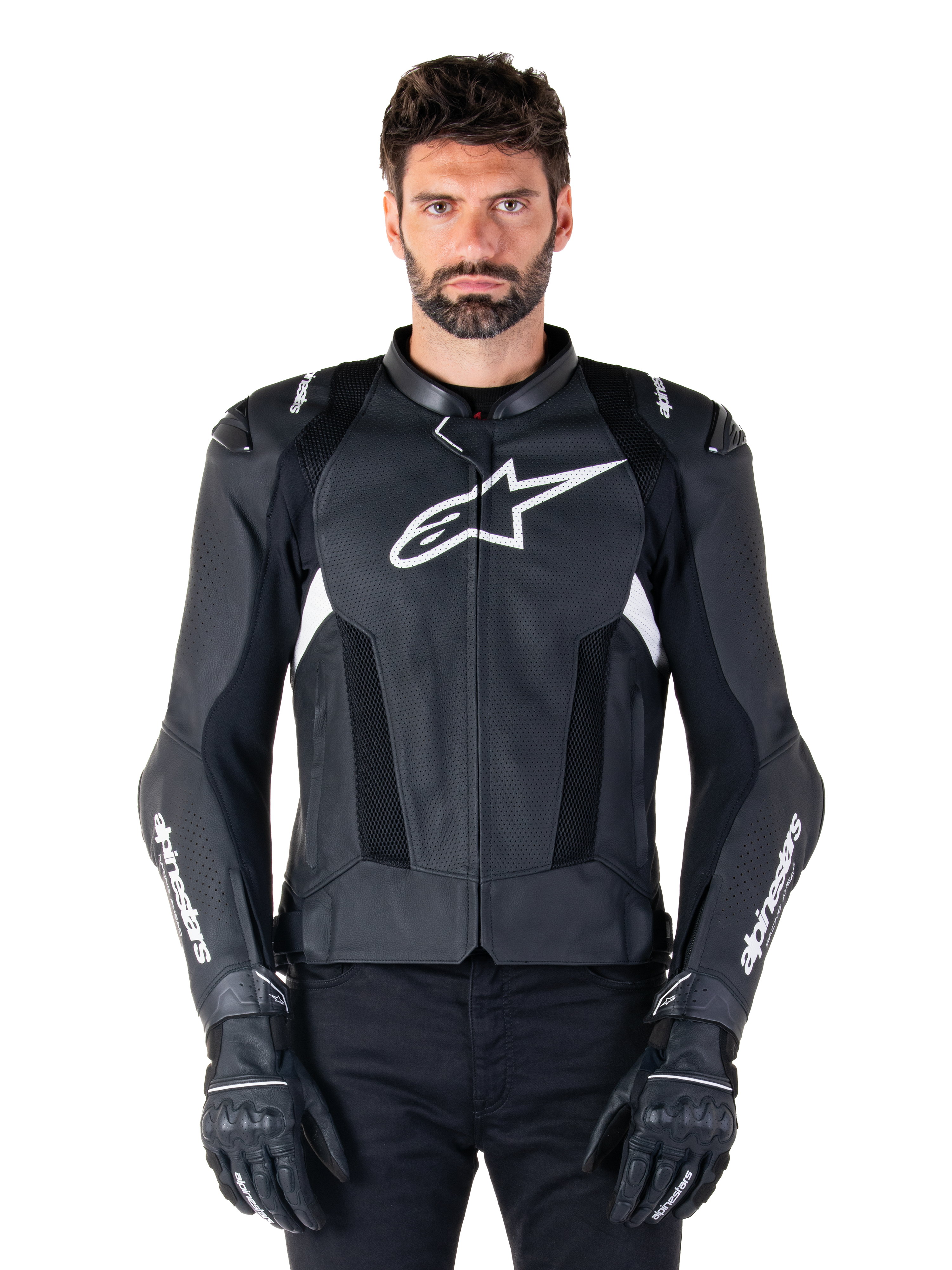 Alpinestars Missile V3 Airflow Leather Jacket, Black and White, motorcycle racing jacket with perforated leather ventilation panels, large white star logo on chest, worn with matching gloves, sporty protective design