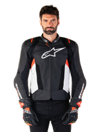 Alpinestars Missile V3 Airflow Leather Jacket, Motorcycle Racing Jacket, Black and White with Red Fluo accents, perforated ventilation panels, white star logo on chest, worn with black and red gloves, premium leather construction
