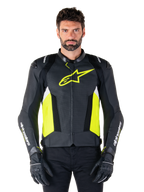 Alpinestars Missile V3 Airflow Leather Jacket, Racing Sport Motorcycle Jacket, Black Yellow Fluo and White, worn by a model with black riding gloves, featuring perforated leather on the chest, bold yellow fluo logo, and white branding on the sleeves