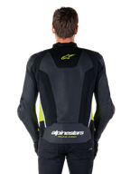 Alpinestars Missile V3 Airflow Leather Jacket, back view, black with fluo yellow and white accents, extensive perforated leather panels for cooling, Alpinestars branding on the upper and lower back, racing-inspired motorcycle sport jacket
