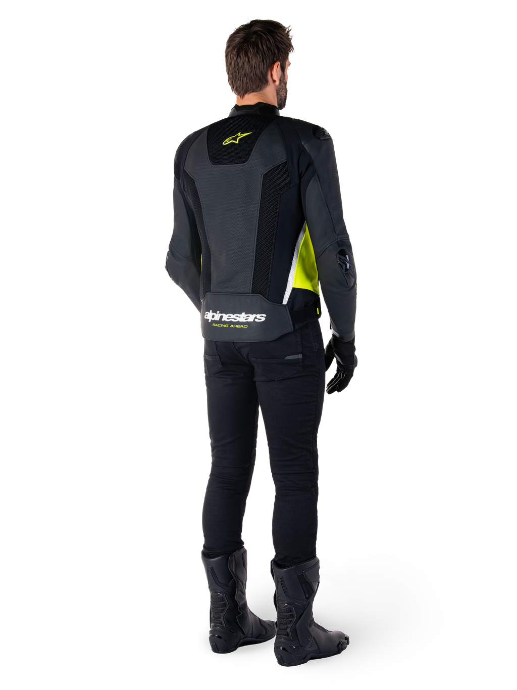 Alpinestars Missile V3 Airflow Leather Jacket, Black Yellow Fluo White, rear view on rider, featuring perforated leather back panels, yellow Alpinestars logo, and white accents, worn with black riding pants and boots