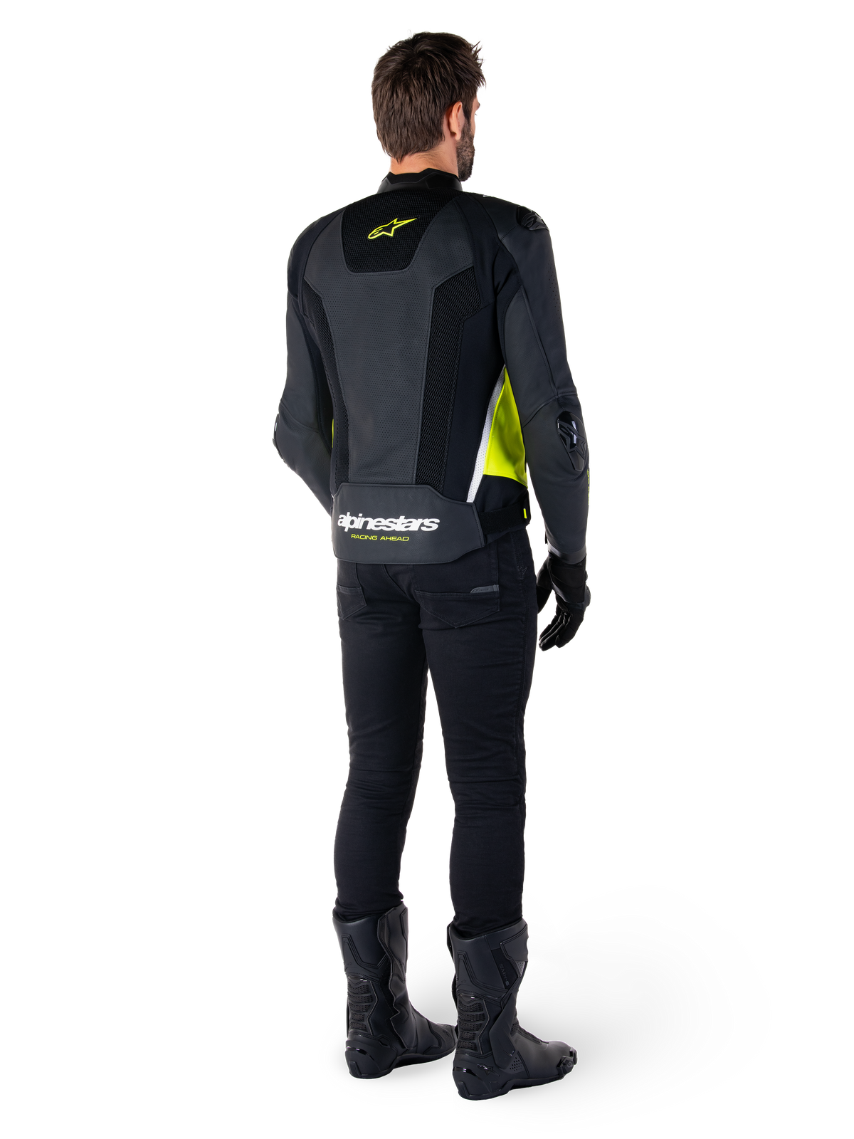 Alpinestars Missile V3 Airflow Leather Jacket, Black Yellow Fluo White, rear view on rider, featuring perforated leather back panels, yellow Alpinestars logo, and white accents, worn with black riding pants and boots