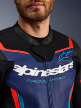 Alpinestars GP Force V2 Leather Jacket, detail view of chest and collar, Blue Black and Red Fluo, featuring white Alpinestars logo and light blue 'RACING AHEAD' text, premium leather texture with fluorescent accents