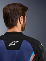 Alpinestars GP Force V2 Leather Jacket, close-up back view of the neck and upper shoulders, white Astars logo on black panel, blue leather construction with fluorescent red and light blue accents, sport riding gear