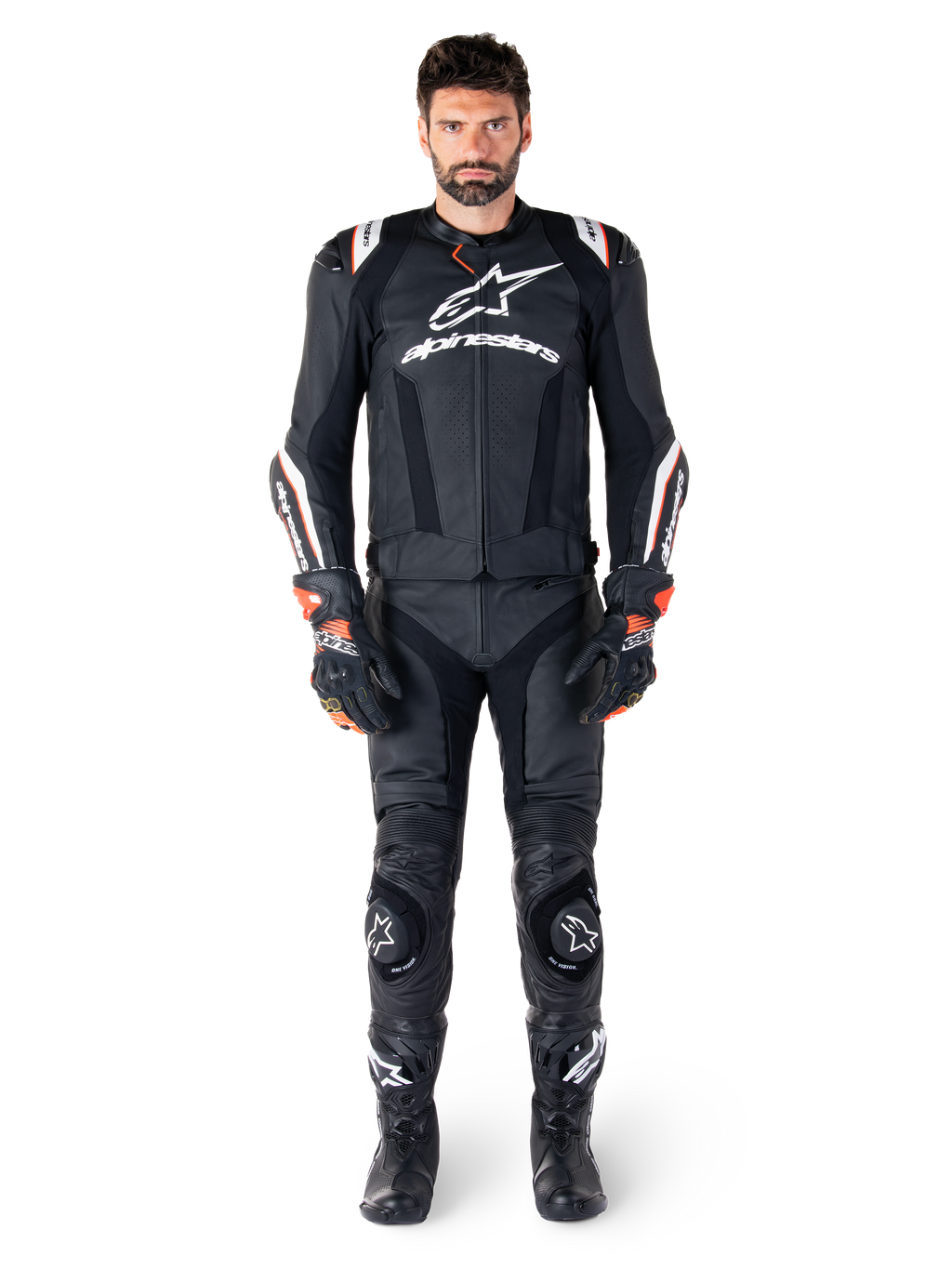 Male rider wearing the Alpinestars Missile V3 Ignition Leather Jacket in Black, paired with matching leather pants, gloves, and boots, featuring white Alpinestars branding and red accents, designed for professional racing performance.
