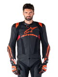 Alpinestars Missile V3 Ignition Leather Jacket, Motorcycle Racing Jacket, Black and Red Fluo, worn with matching racing gloves and leather pants, featuring perforated ventilation and prominent Alpinestars branding, professional racing gear