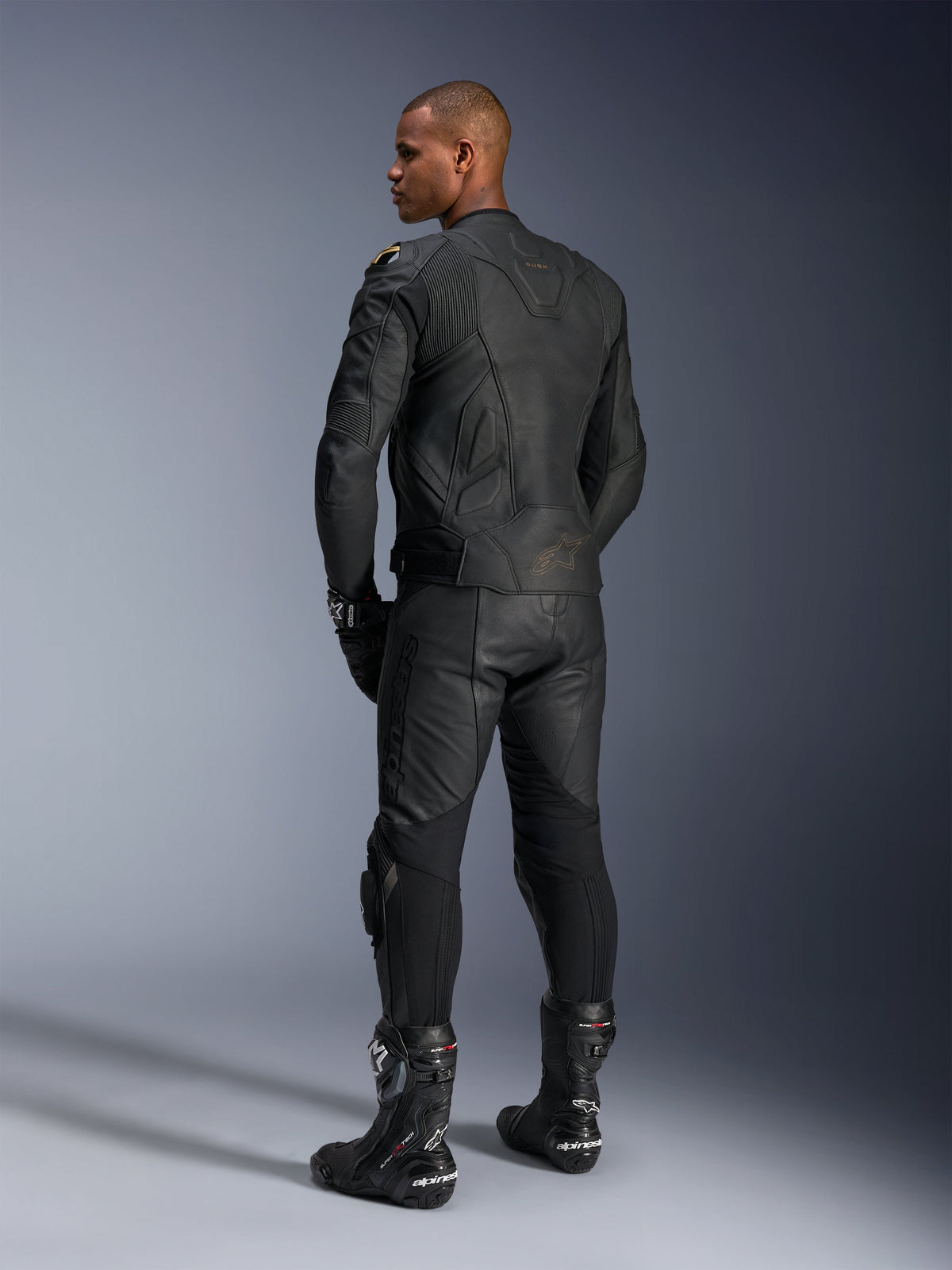 Alpinestars Dusk Leather Jacket, Black, men's motorcycle racing jacket in premium leather, rear view on model.