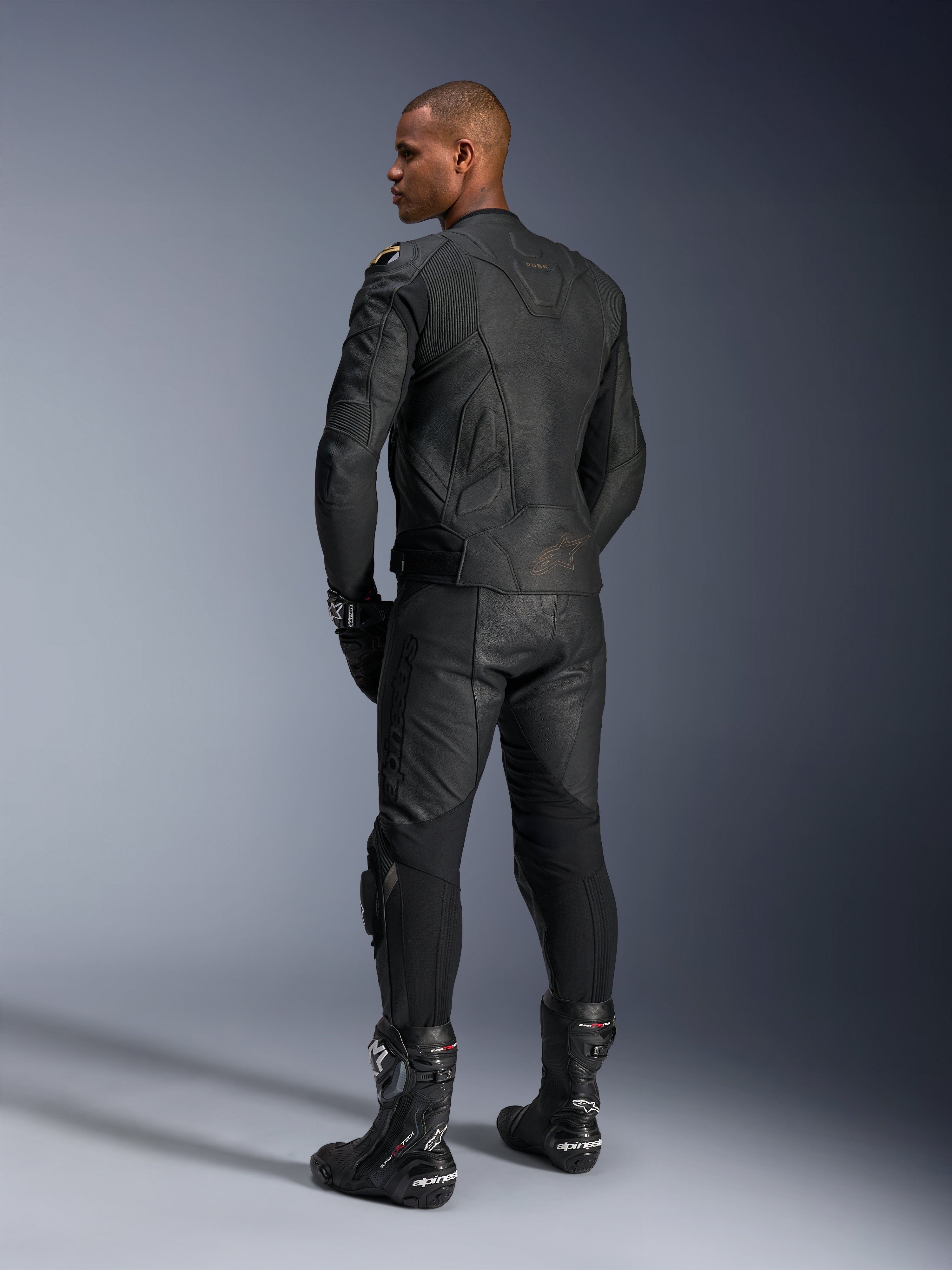 Alpinestars Dusk Leather Jacket, Black, men's motorcycle racing jacket in premium leather, rear view on model.