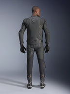 Male model shown from the back wearing the Alpinestars Dusk Airflow Leather Jacket in Black, paired with matching black leather racing pants, gloves, and boots, featuring extensive perforations for ventilation and the Alpinestars logo on the lower back.