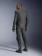 Male rider from behind wearing the Alpinestars Dusk Airflow Leather Jacket in Black Black, paired with matching leather pants, gloves, and boots, highlighting the extensive back perforations and performance sport fit.