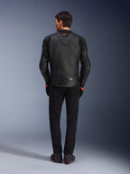 Alpinestars GP Plus R V4 Airflow Leather Jacket, Black, back view of rider wearing complete gear, features perforated leather for ventilation and red logo accents, sleek sport-fit design, paired with black pants and riding boots