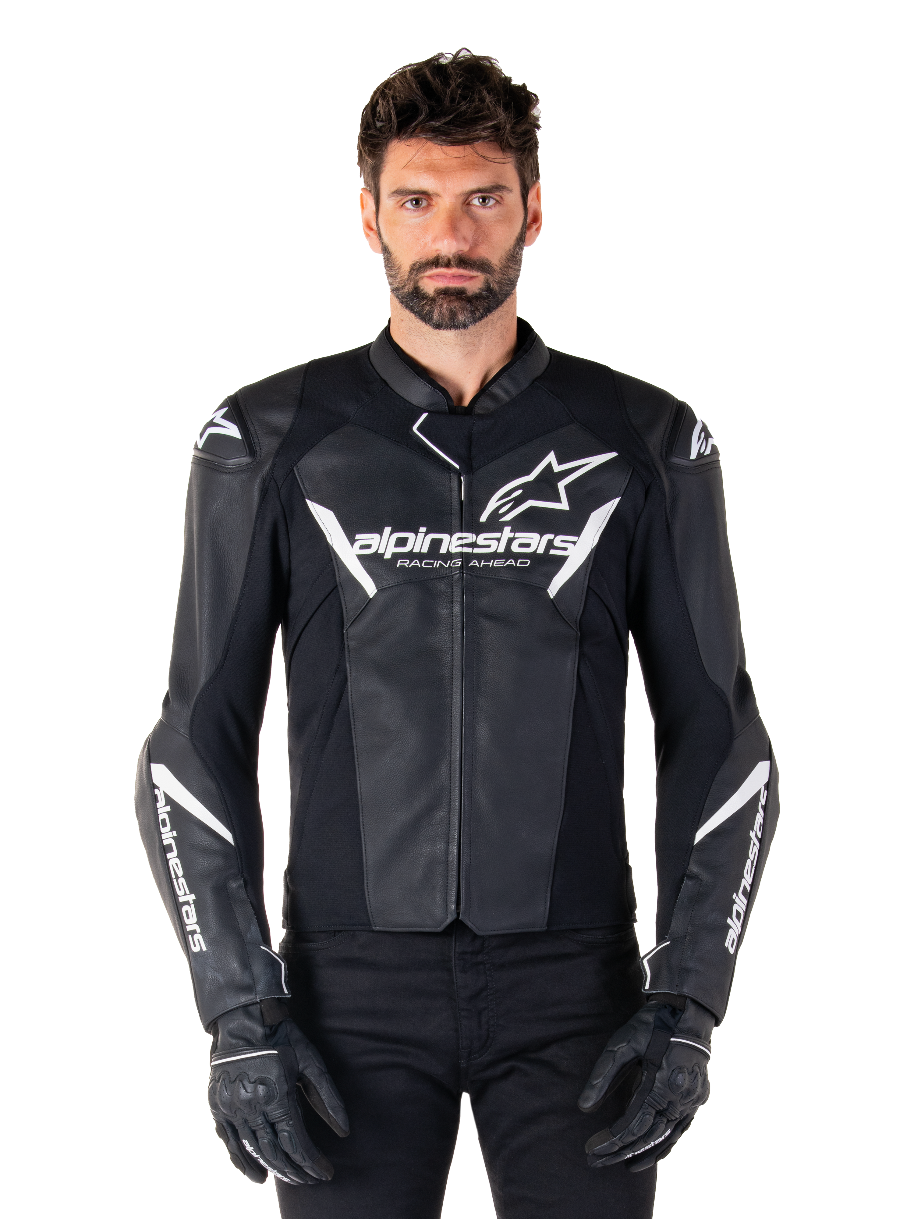 Alpinestars Faster V3 Leather Jacket, Black and White Motorcycle Racing Jacket, featuring bold white logos and 'Racing Ahead' chest text, sleek leather design with angular accents on sleeves, worn with black racing gloves