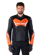 Alpinestars Faster V3 Airflow Leather Jacket, Motorcycle Racing Jacket, Black and Red Fluo, perforated leather construction with white and red accents, worn with black gloves, performance street riding gear