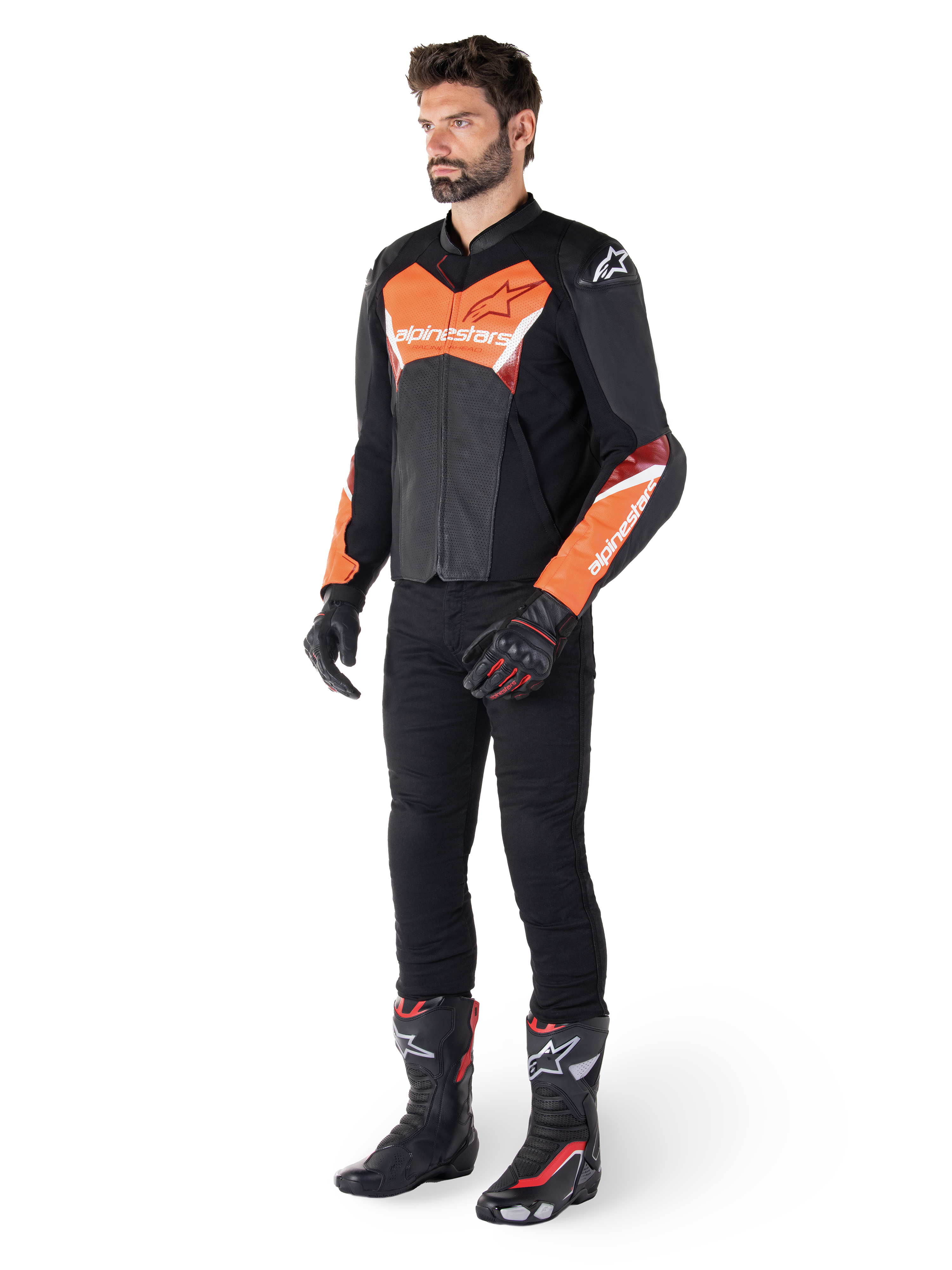 Alpinestars Faster V3 Airflow Leather Jacket, Black and Red Fluo, worn by a male model with black riding pants, gloves, and racing boots, featuring perforated leather and a sport silhouette.