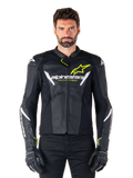 Alpinestars Faster V3 Airflow Leather Jacket, Black White and Yellow Fluo, worn by a male model with matching black gloves, featuring perforated leather panels for ventilation and bold Alpinestars branding on the chest, sport motorcycle riding gear