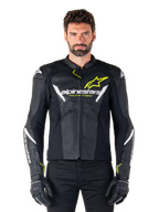Alpinestars Faster V3 Airflow Leather Jacket, Black White and Yellow Fluo, worn by a male model with matching black gloves, featuring perforated leather panels for ventilation and bold Alpinestars branding on the chest, sport motorcycle riding gear