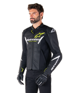 Alpinestars Faster V3 Airflow Leather Jacket, Sport Motorcycle Jacket, Black White and Yellow Fluo, worn by a man, featuring perforated leather for airflow, Alpinestars logos on chest and arms, paired with black gloves.