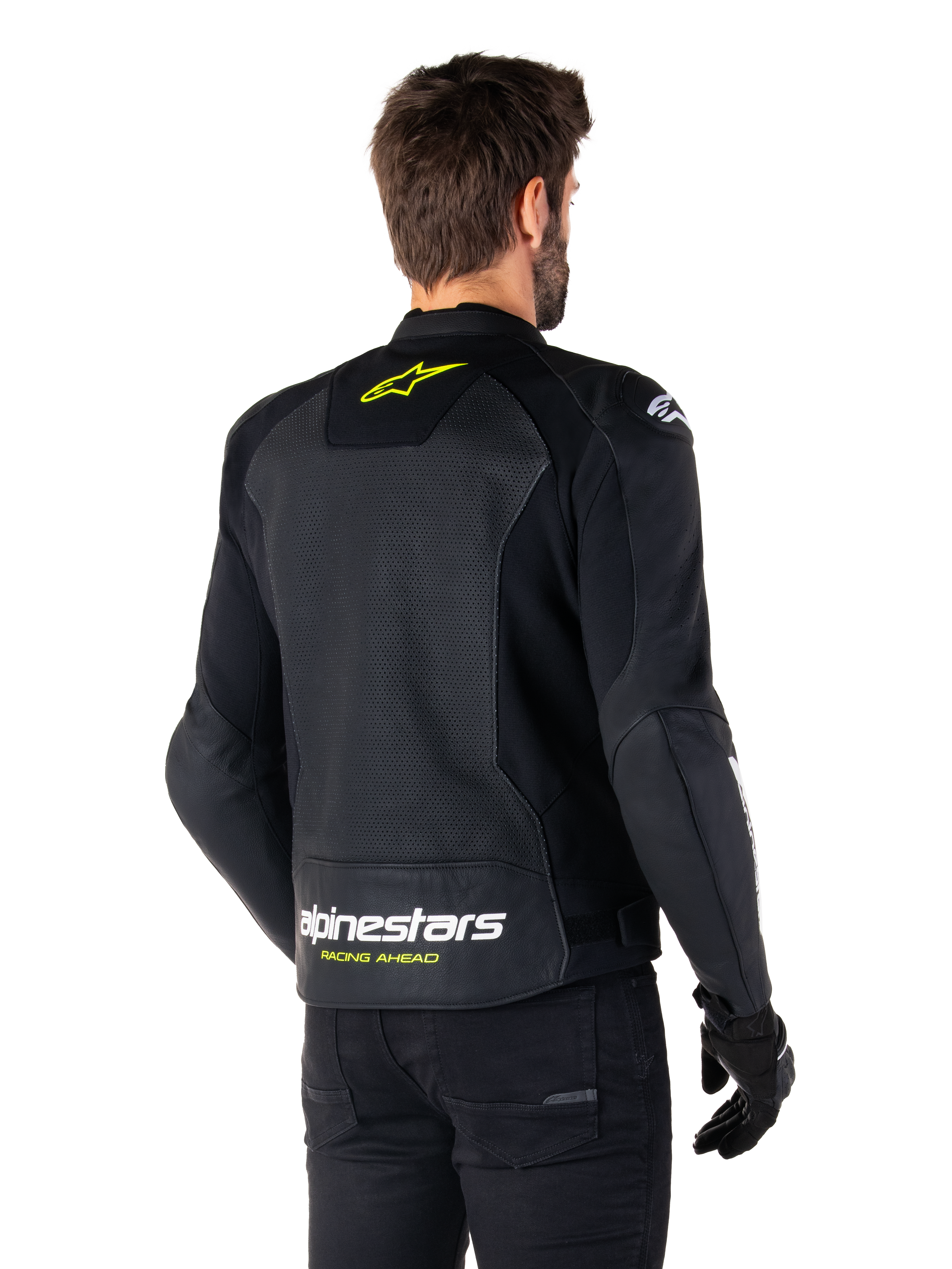 Alpinestars Faster V3 Airflow Leather Jacket, Black White and Yellow Fluo, rear view, featuring a large perforated leather back panel for ventilation, yellow star logo on the collar, and white Alpinestars branding with yellow 'Racing Ahead' text on the lower hem, sport motorcycle riding gear