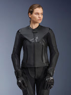 Alpinestars Stella GP Plus V4 Leather Jacket, Black, Women's Motorcycle Racing Jacket, premium leather construction with protective padding, sleek design with subtle logo, worn by a female model with matching black gear