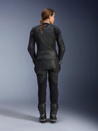 Alpinestars Women Stella GP Plus V4 Leather Jacket, Black Black, full-body rear view of a female rider wearing matching leather pants and boots, sleek minimalist design with a small red logo on the neck, tailored sport silhouette for women