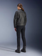 Alpinestars Stella Dyno Leather Jacket, Women's Motorcycle Jacket, Black, rear view showing premium leather construction and tailored fit, worn with black riding pants and black boots, urban riding style.