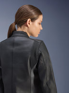 Stella Dyno Leather Jacket, Women's Motorcycle Jacket, Black, close-up back view featuring accordion stretch panels behind the shoulder and metal ventilation eyelets, premium bovine leather construction with a clean heritage-inspired design.