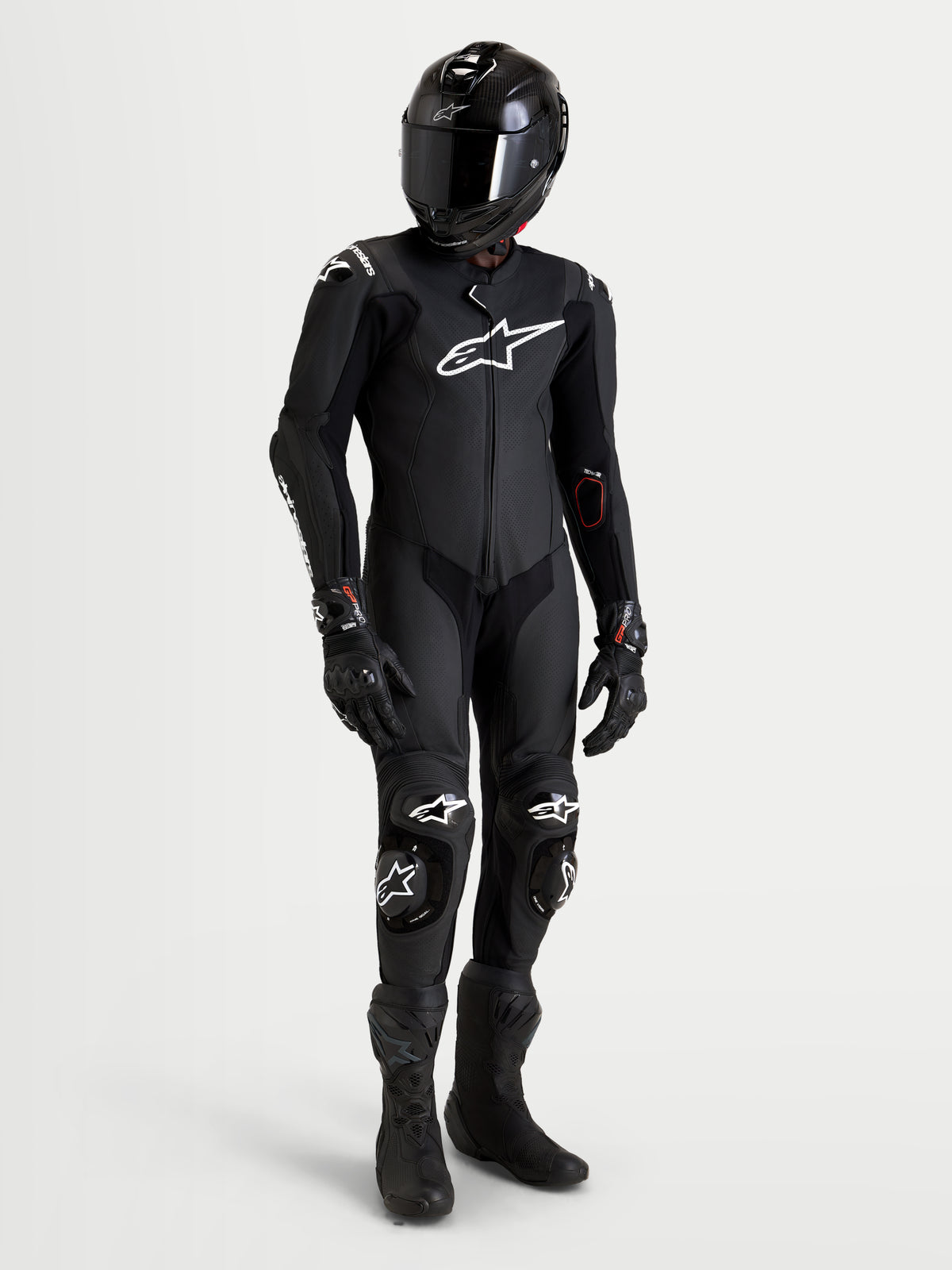 Alpinestars Missile V3 Leather Suit - 1 Piece, men's black motorcycle racing leather suit with integrated armor and matching black helmet, boots, and gloves, AAA certified